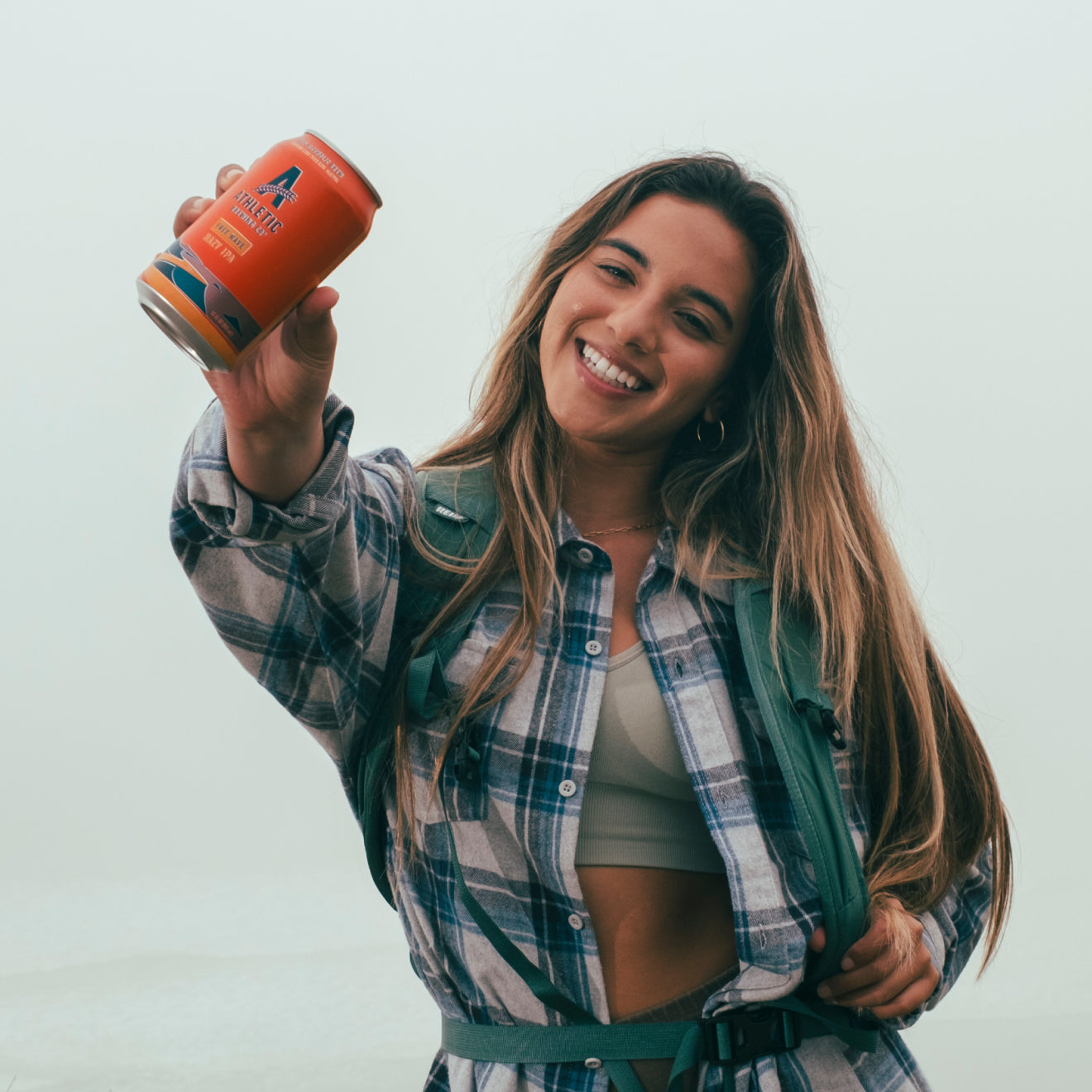 person holding a free wave can