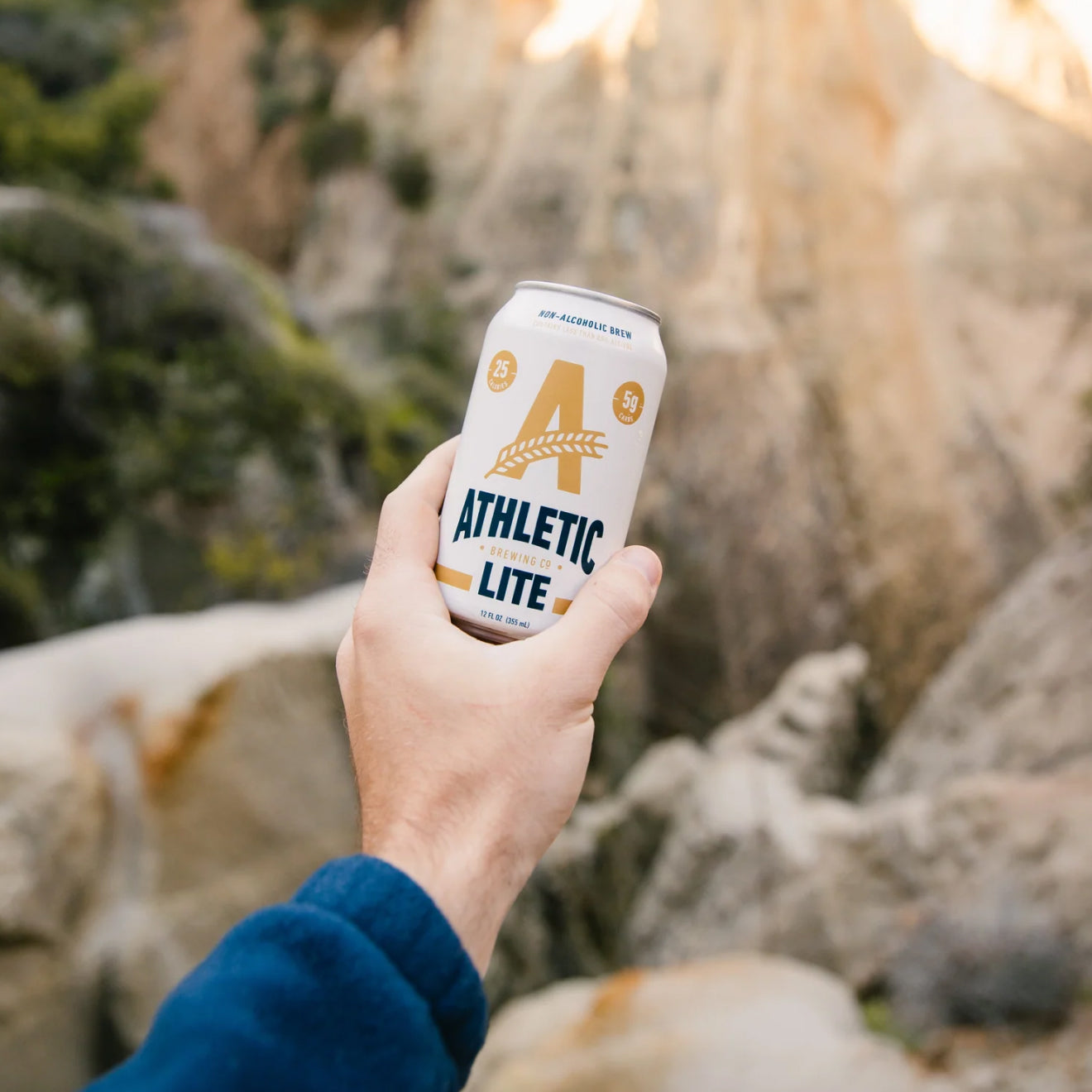 holding a can of athletic lite